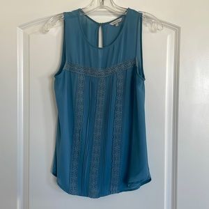 Dusty blue sleeveless blouse. Size medium